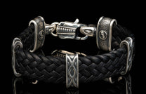 The black ‘Tilt’ leather bracelet from William Henry features widely woven kangaroo leather adorned with textured and patinated sterling silver details.