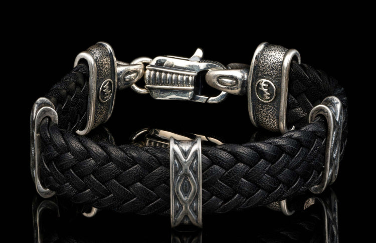 The black ‘Tilt’ leather bracelet from William Henry features widely woven kangaroo leather adorned with textured and patinated sterling silver details.
