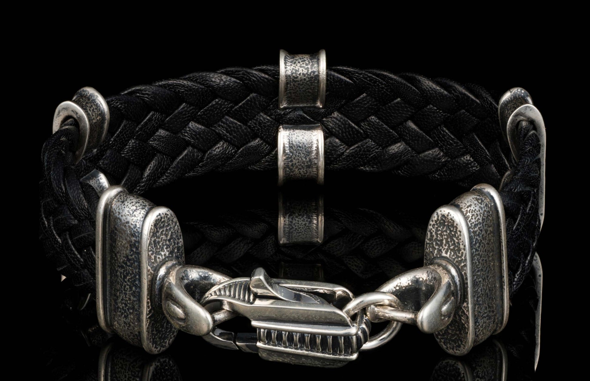 The black ‘Tilt’ leather bracelet from William Henry features widely woven kangaroo leather adorned with textured and patinated sterling silver details.