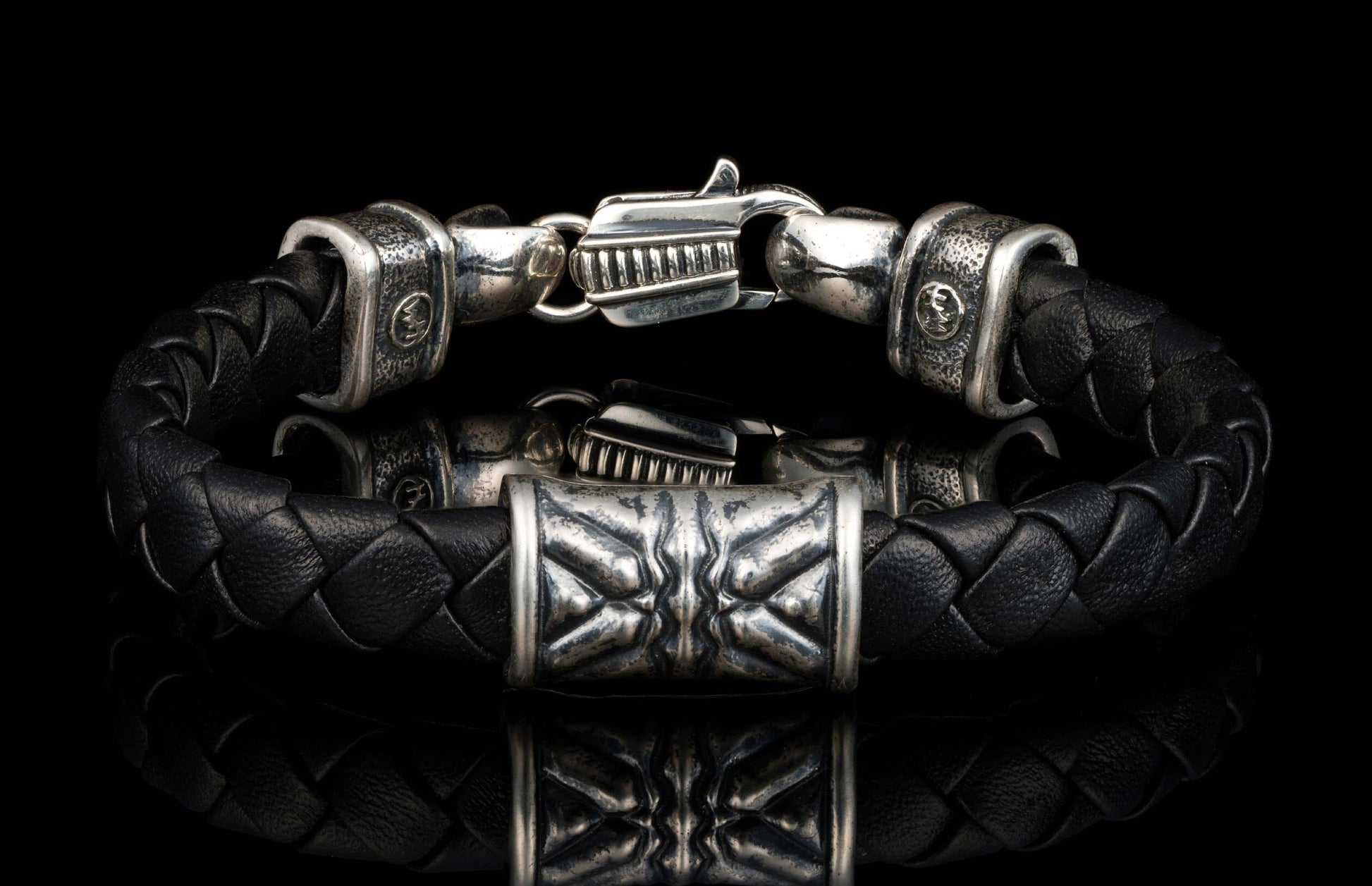The black ‘Thunderbloom’ leather bracelet from William Henry features braided lambskin leather adorned with textured and patinated sterling silver details