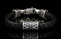 The black ‘Thunderbloom’ leather bracelet from William Henry features braided lambskin leather adorned with textured and patinated sterling silver details