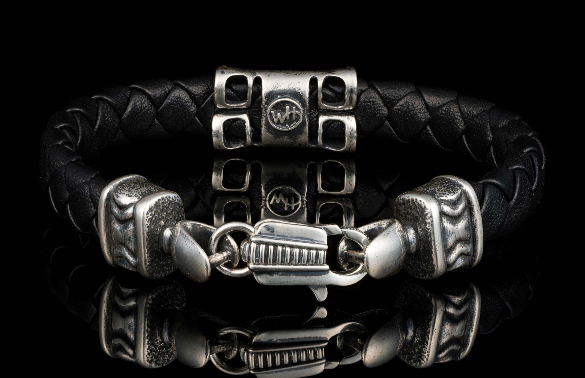 The black ‘Thunderbloom’ leather bracelet from William Henry features braided lambskin leather adorned with textured and patinated sterling silver details