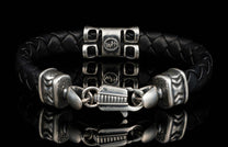 The black ‘Thunderbloom’ leather bracelet from William Henry features braided lambskin leather adorned with textured and patinated sterling silver details