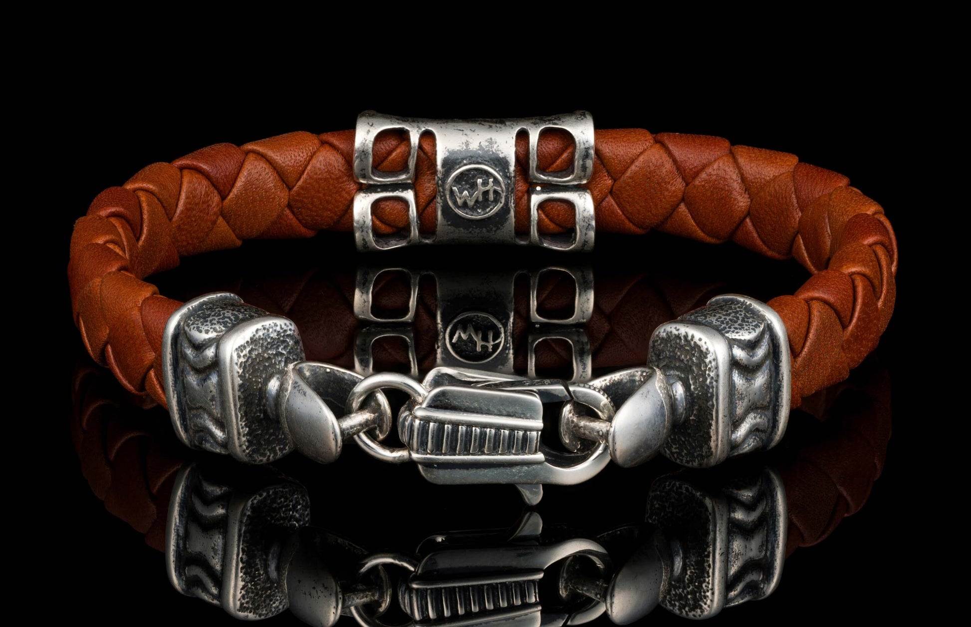 The brown ‘Thunderbloom’ leather bracelet from William Henry features braided lambskin leather adorned with textured and patinated sterling silver details
