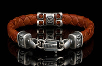 The brown ‘Thunderbloom’ leather bracelet from William Henry features braided lambskin leather adorned with textured and patinated sterling silver details