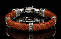 The brown ‘Norn’ leather bracelet from William Henry features braided lambskin leather adorned with textured and patinated sterling silver details.