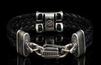The ‘Rhomb’ leather bracelet from William Henry features woven kangaroo leather adorned with textured and patinated sterling silver details.