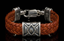 The ‘Rhomb’ leather bracelet from William Henry features brown woven kangaroo leather adorned with textured and patinated sterling silver details.