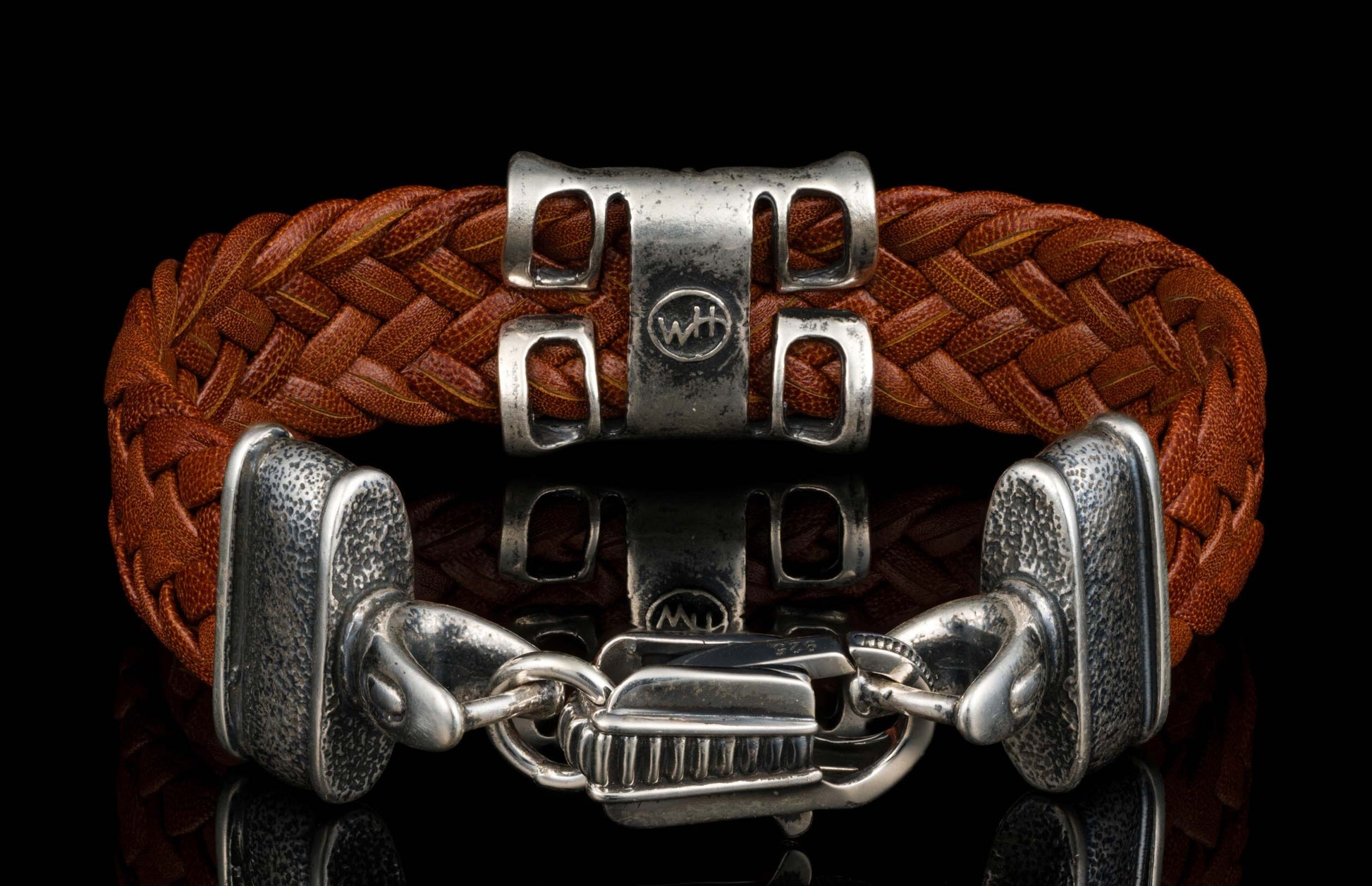 The ‘Rhomb’ leather bracelet from William Henry features brown woven kangaroo leather adorned with textured and patinated sterling silver details.
