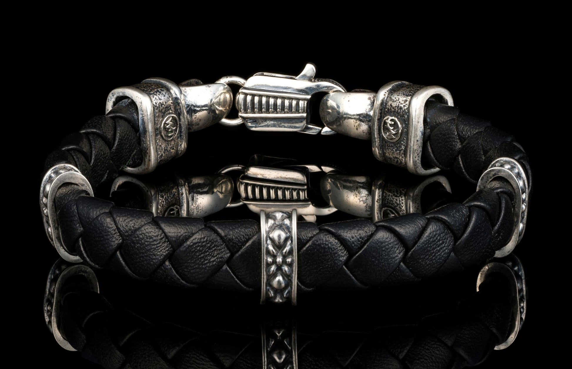 The black ‘Norn’ leather bracelet from William Henry features braided lambskin leather adorned with textured and patinated sterling silver details