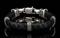 The black ‘Norn’ leather bracelet from William Henry features braided lambskin leather adorned with textured and patinated sterling silver details