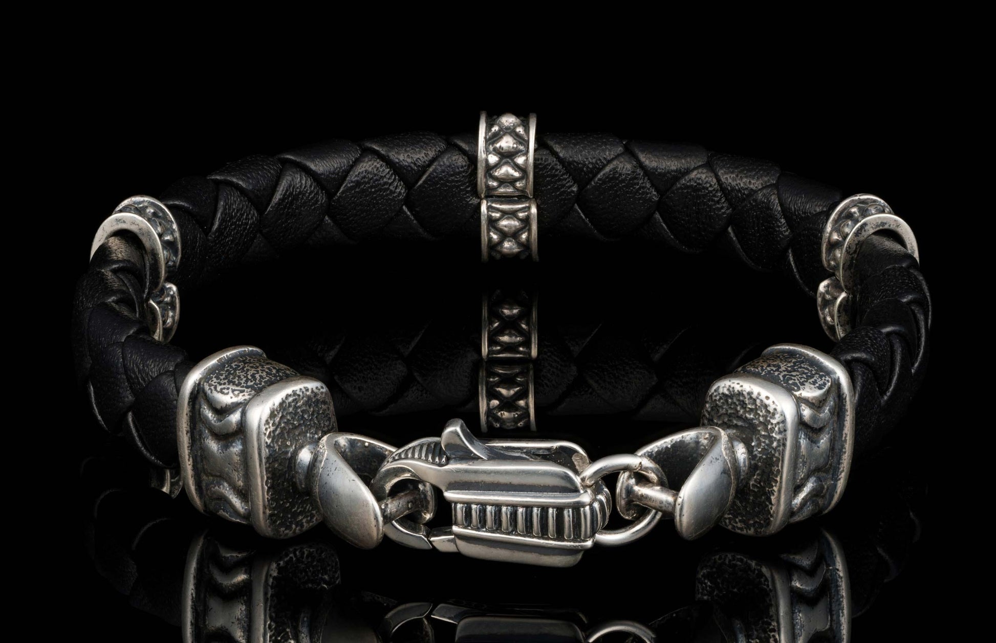 The black ‘Norn’ leather bracelet from William Henry features braided lambskin leather adorned with textured and patinated sterling silver details