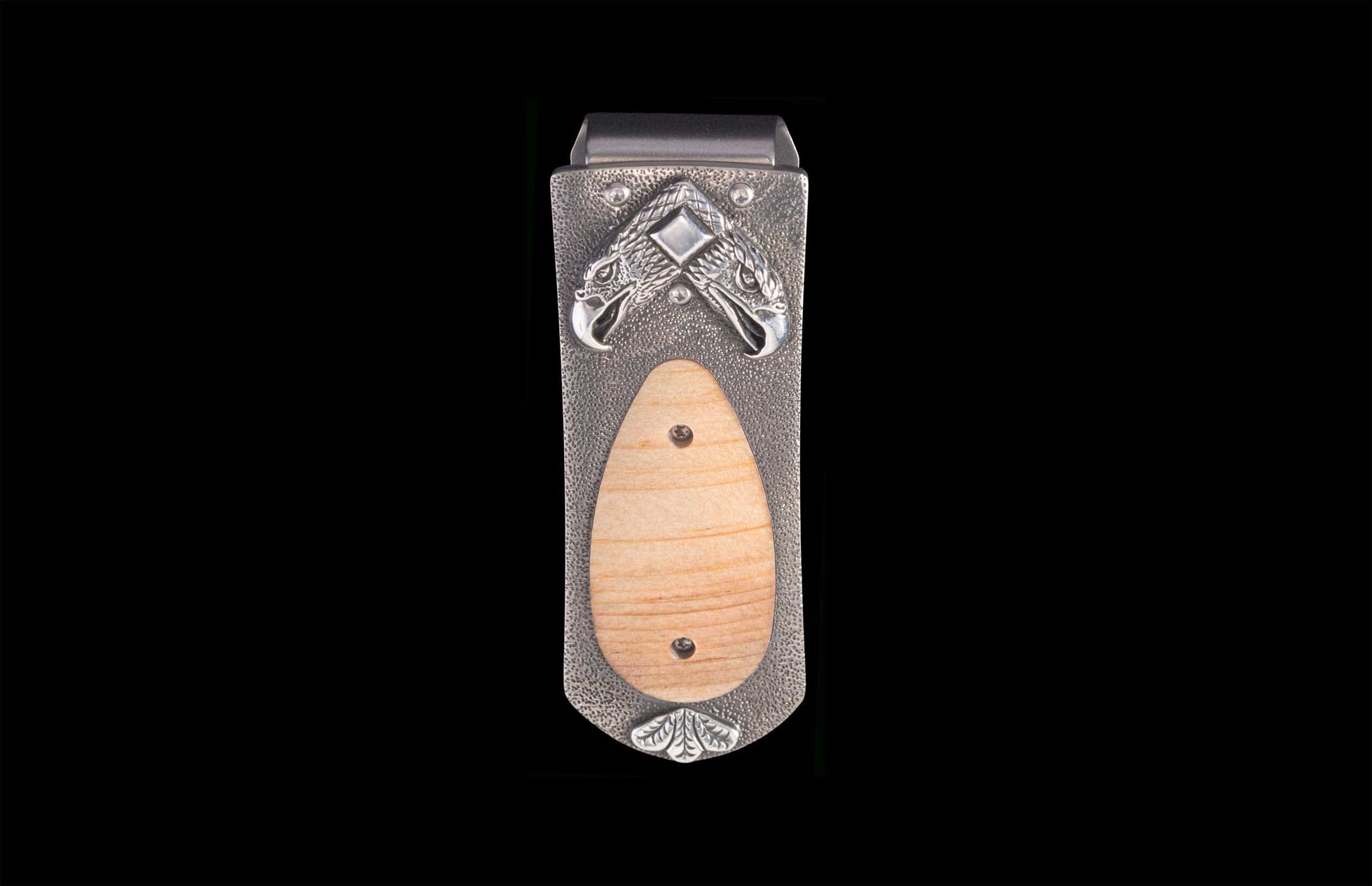 Handcrafted money clip from William Henry featuring  eagle heads in hand-carved sterling silver inlaid with wood from the original beams of Independence Hall. 