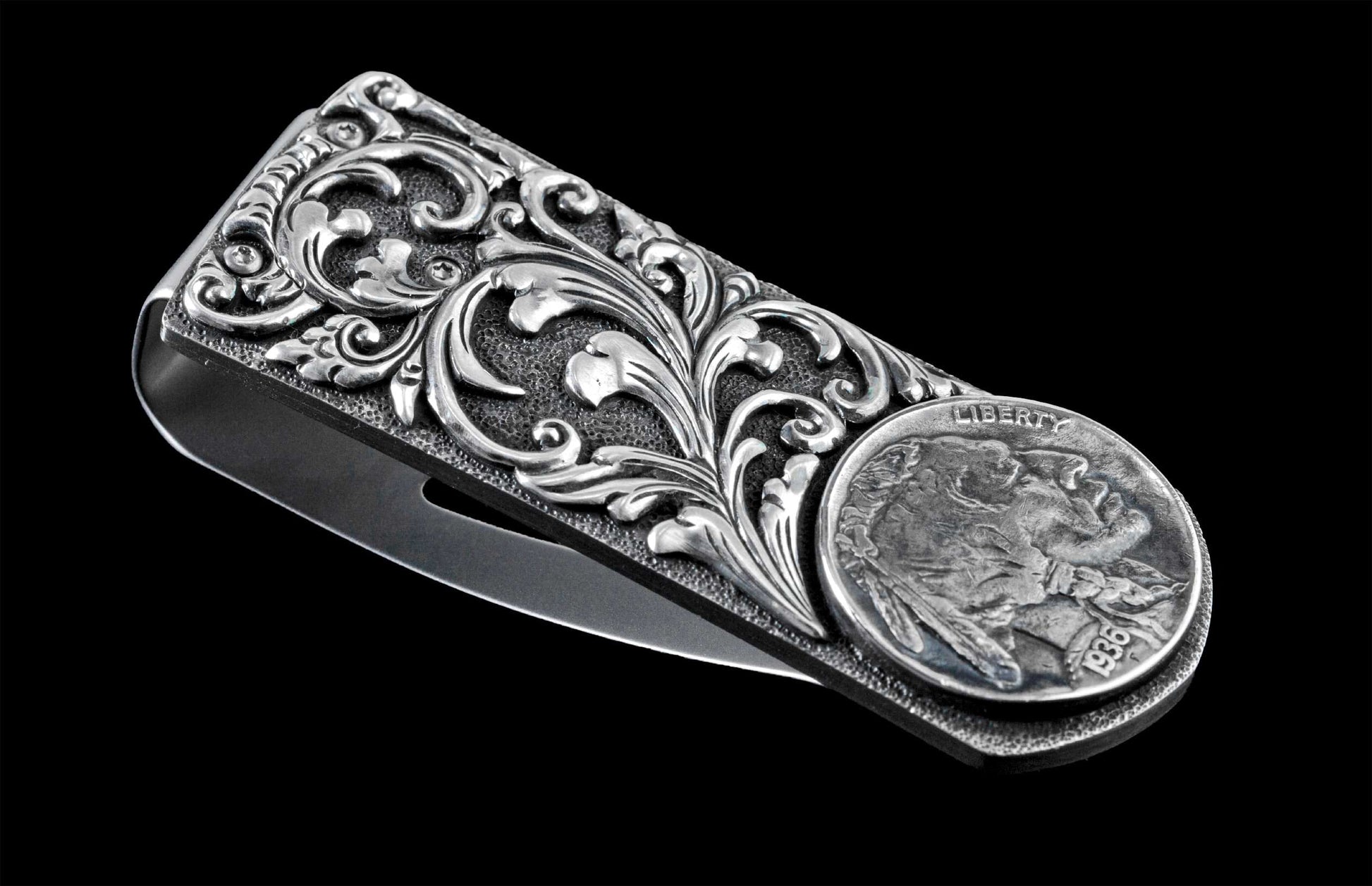 Handcrafted money clip from William Henry features hand-carved sterling silver body with an inlaid Buffalo Nickel, and finished with a beautiful patina.