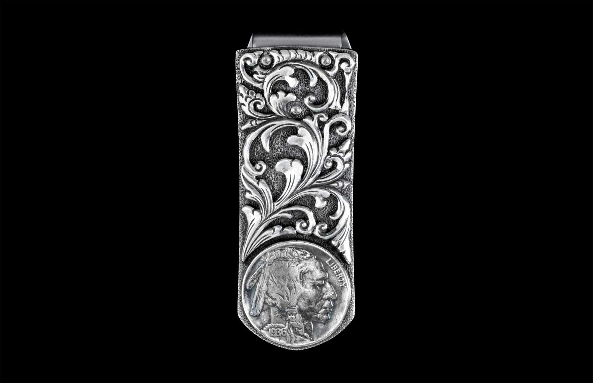 Handcrafted money clip from William Henry features hand-carved sterling silver body with an inlaid Buffalo Nickel