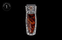 Silver-toned money clip with a brass skull, dark burl wood inlay, and ornate scrollwork details.
