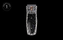 Silver money clip with a gold skull emblem, black carbon fiber inlay, and intricate silver scrollwork.