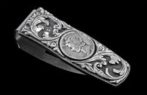 Handcrafted money clip from William Henry is hand-carved sterling silver by Lee Downey, and inlaid with a Mercury dime.