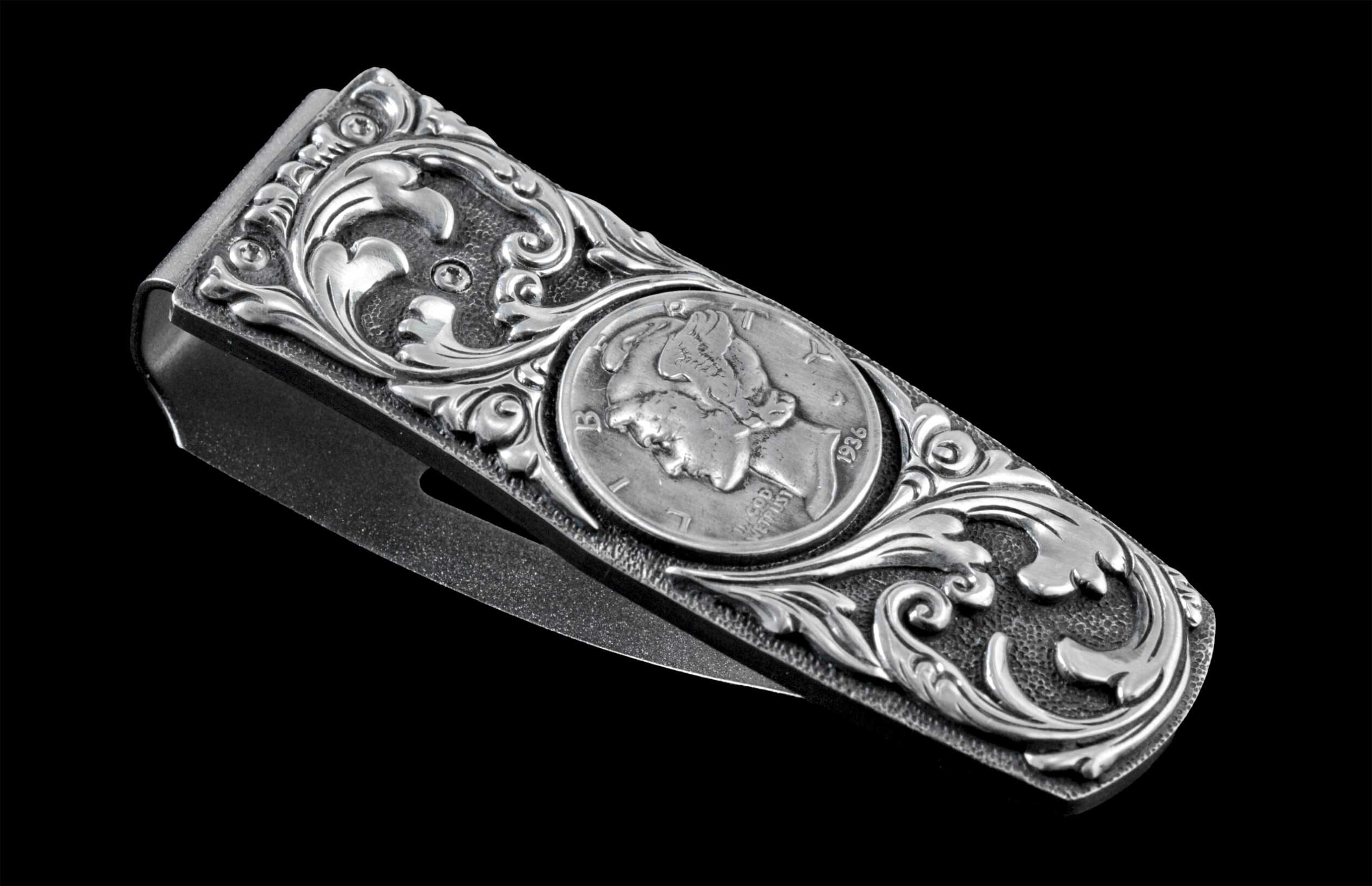 Handcrafted money clip from William Henry is hand-carved sterling silver by Lee Downey, and inlaid with a Mercury dime.