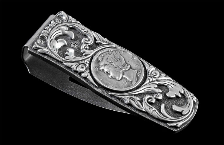 Handcrafted money clip from William Henry is hand-carved sterling silver by Lee Downey, and inlaid with a Mercury dime.
