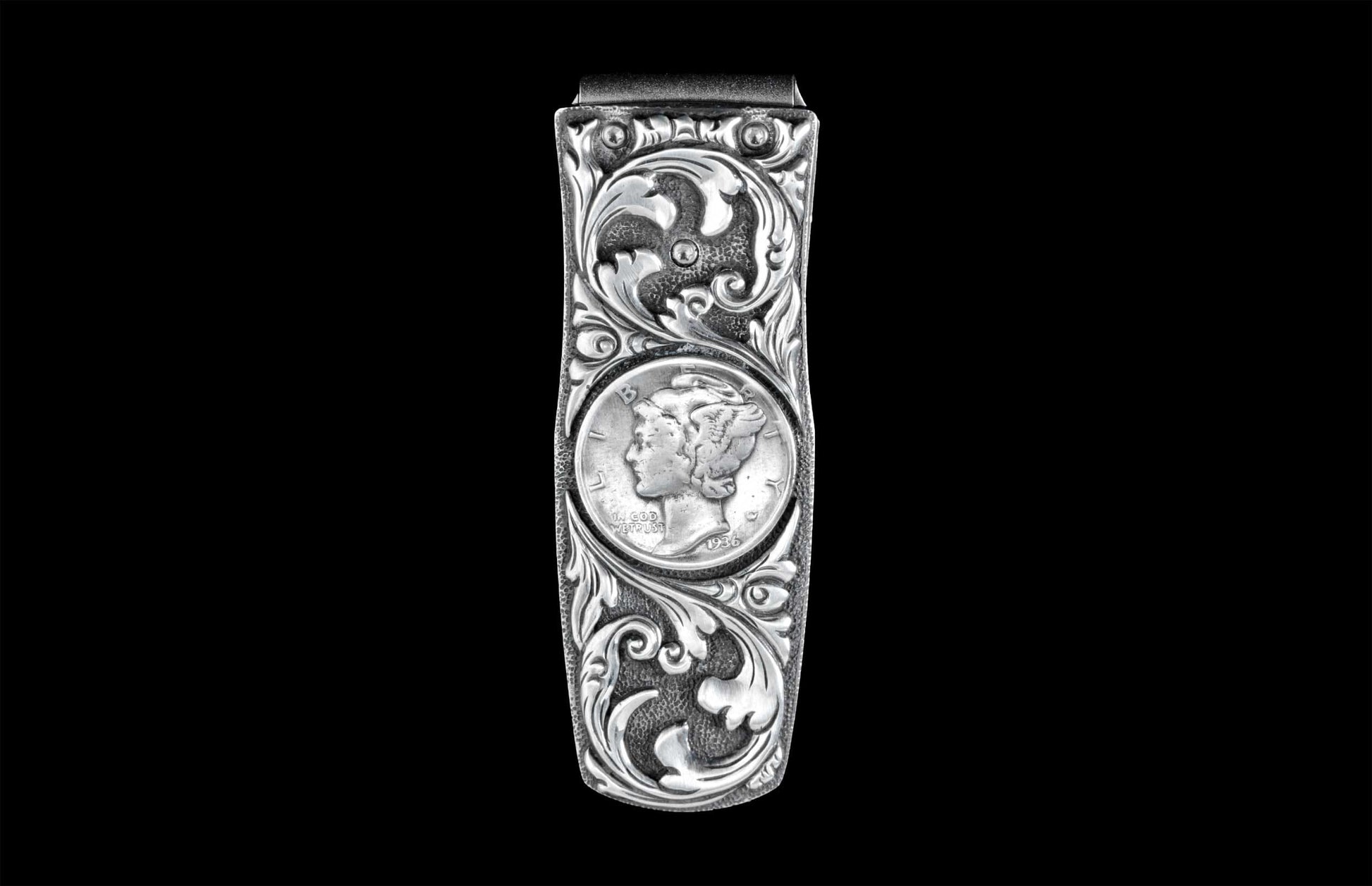 Handcrafted money clip from William Henry is hand-carved sterling silver by Lee Downey