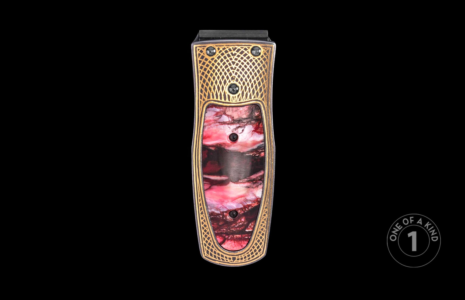 Luxury money clip with intricate gold lattice detailing and vibrant red marbled inlay, one of a kind