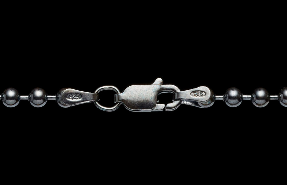 Sterling silver ball chain necklace featuring a lobster clasp with a visible '925' stamp.