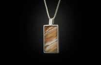 The Mammoth Shift Sterling Silver Pendant Inlaid with Fossil Mammoth Tooth