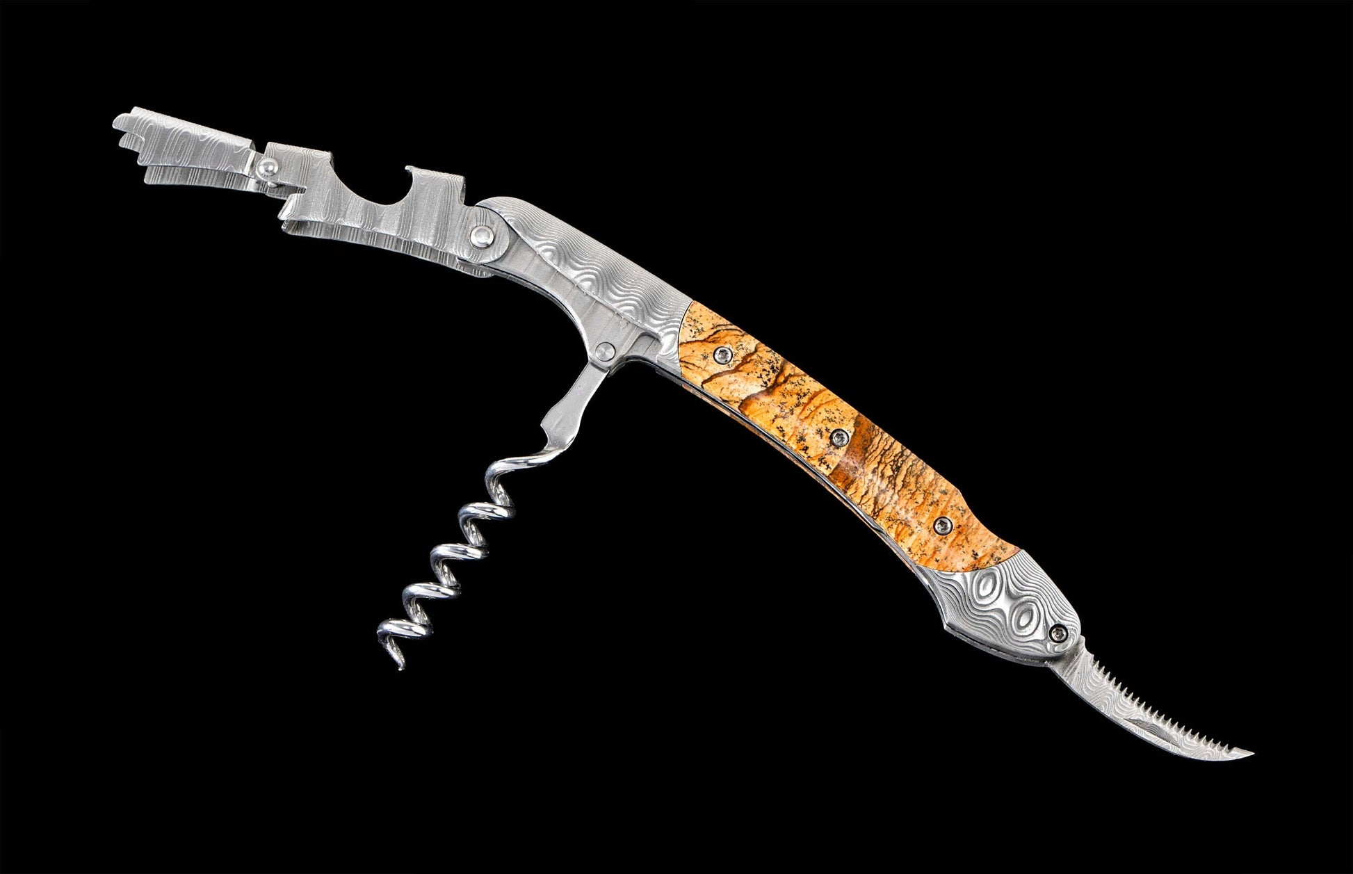 Damascus metal corkscrew with light brown burl wood handle, a serrated foil cutter, and two-step lever, angled on black.