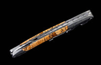 Closed bar multi-tool knife with mottled brown handle and wavy Damascus-patterned metal.