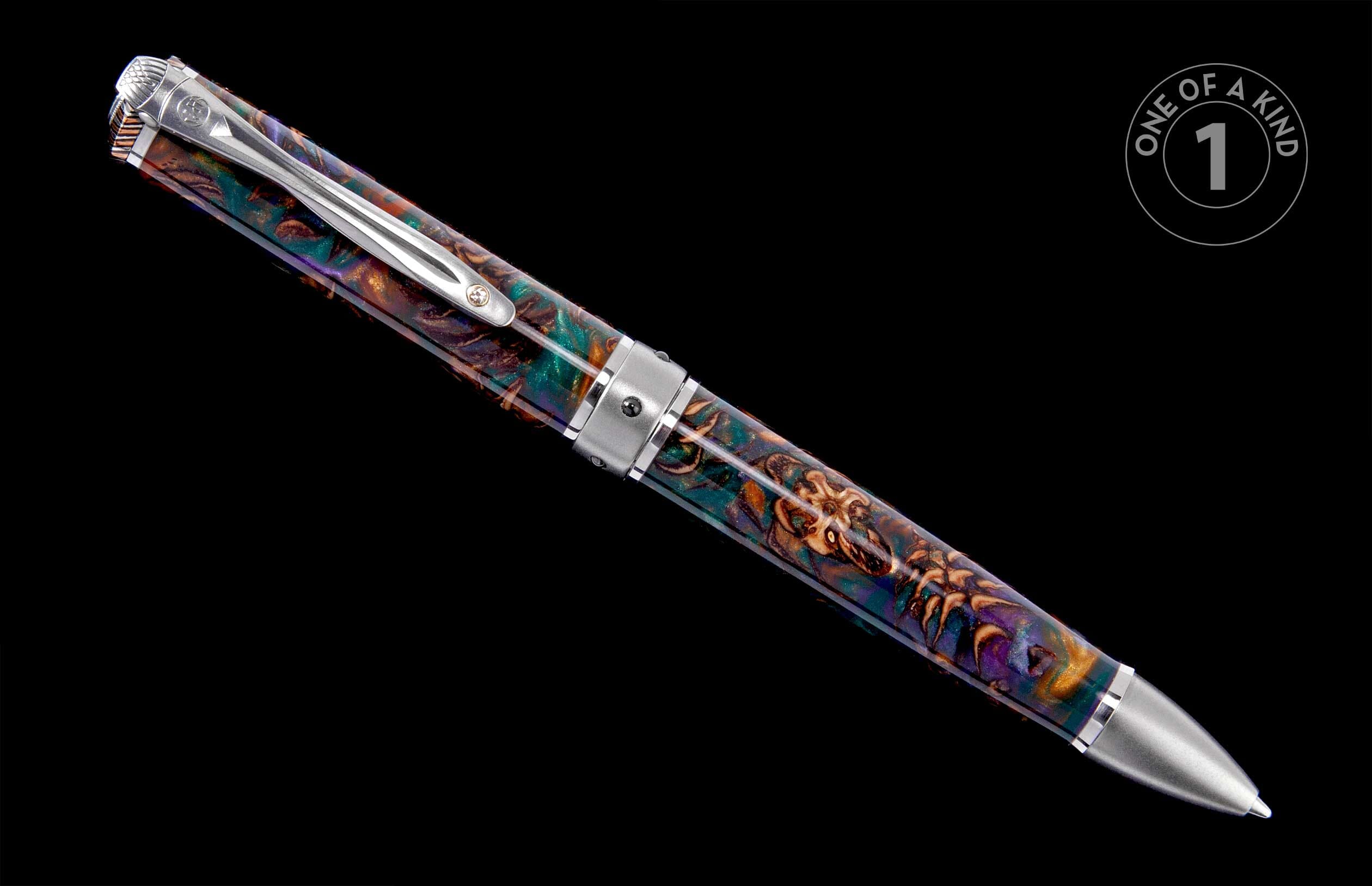 Multi-colored pen featuring a swirling teal, purple, and gold pattern, silver-toned accents, and a 'One of a Kind' graphic.