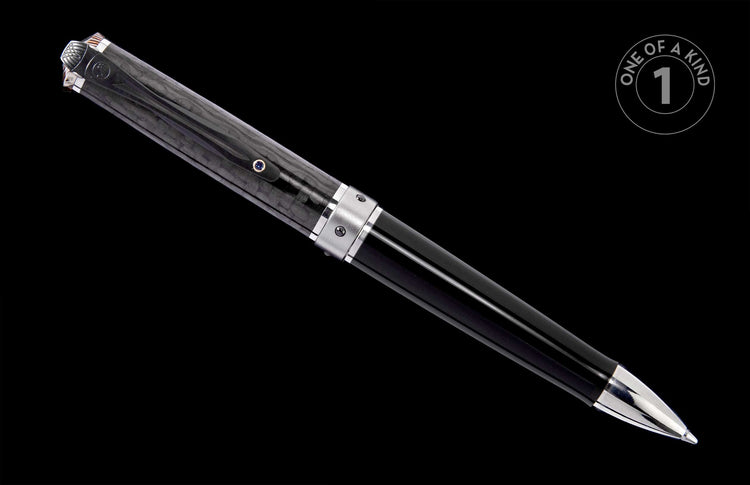 Black textured pen with silver accents and a small blue gemstone, angled.