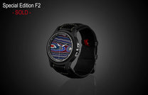 Special edition Fordite dial watch by William Henry, black case with red and blue marbled face, black leather strap with white stitching, side view