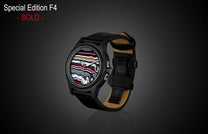 Black automatic watch with vibrant Fordite dial by William Henry, featuring layered red, white, and black patterns, black leather strap with tan lining, side view on dark background.
