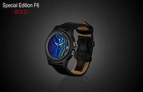 Luxury Fordite dial watch with blue and red marbled pattern by William Henry, black case, leather strap, side view