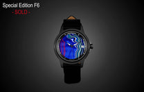 Special Edition Fordite watch by William Henry with vibrant blue marbled dial, black case, and leather strap, front view