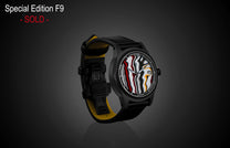 Special Edition Fordite watch by William Henry with marbled red, white, black, and yellow dial, black case, and black leather strap with yellow lining, side view