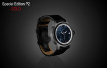 Pietersite dial automatic watch by William Henry with gray patterned case, black leather strap, and silver accents, side view