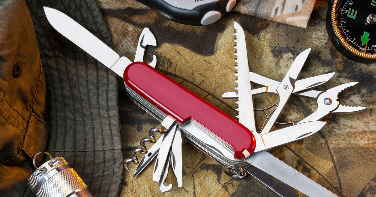 Red swiss army knife on table