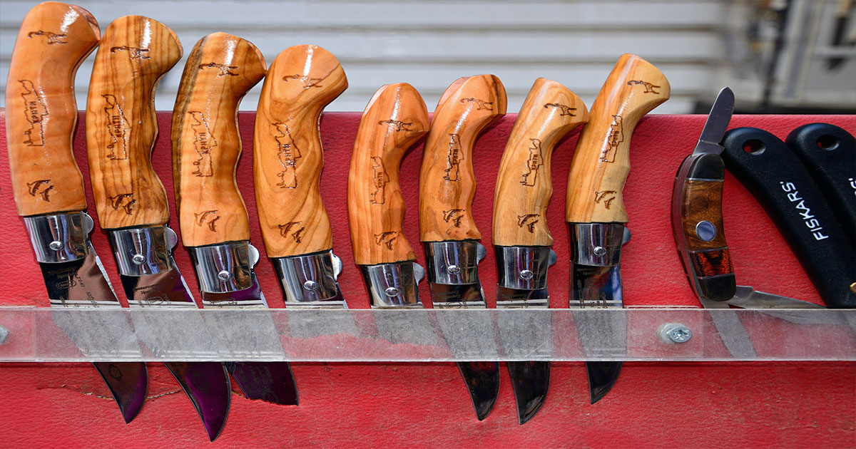 Row of knives with wooden handles