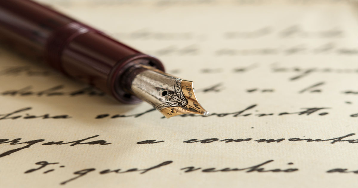 Fountain pen on top of a written letter