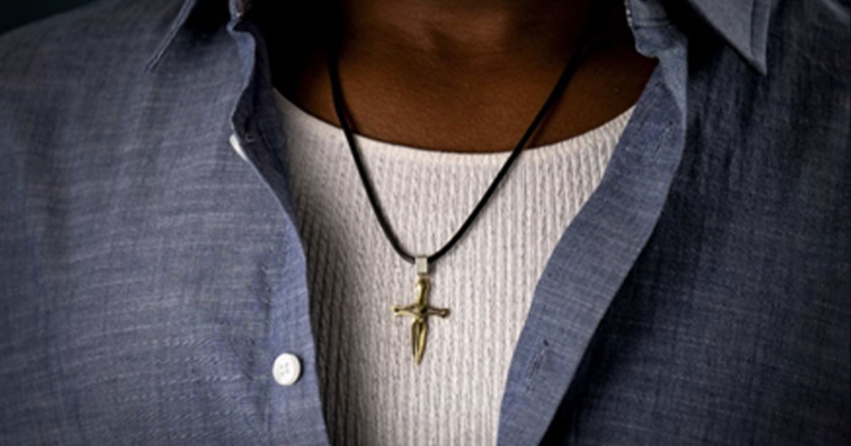 Man wearing cross necklace